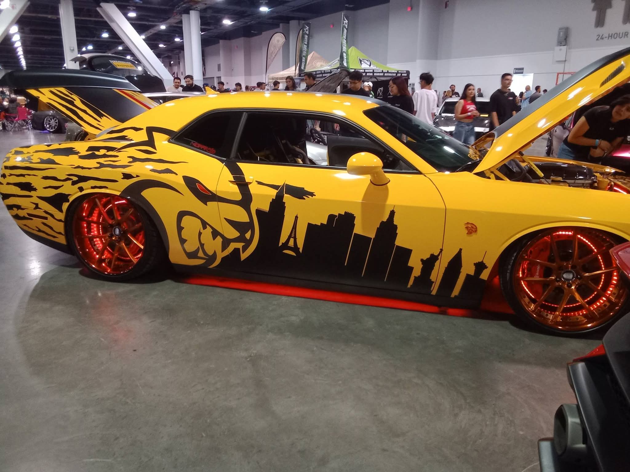 Yellow custom car at an indoor show